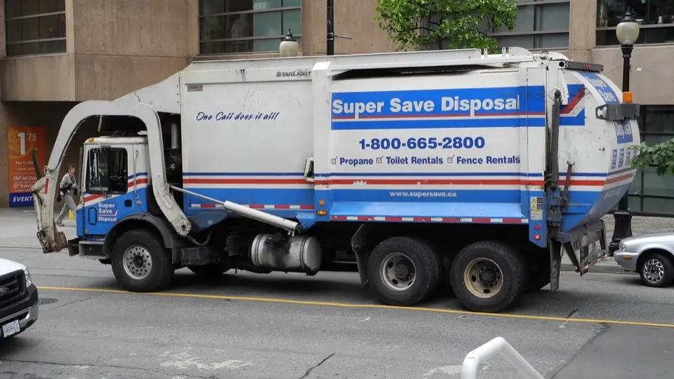 A Super Save Disposal garbage truck on a Vancouver street